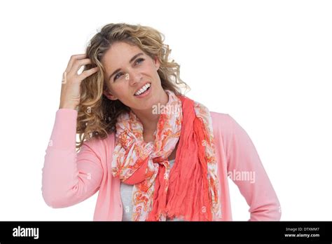 Blonde Woman Scratching Her Head And Smiling Stock Photo Alamy