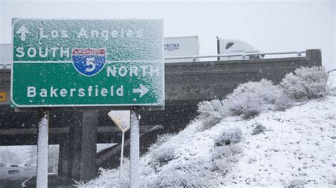 Central U.S. faces winds, record heat; Southern California hit by storm