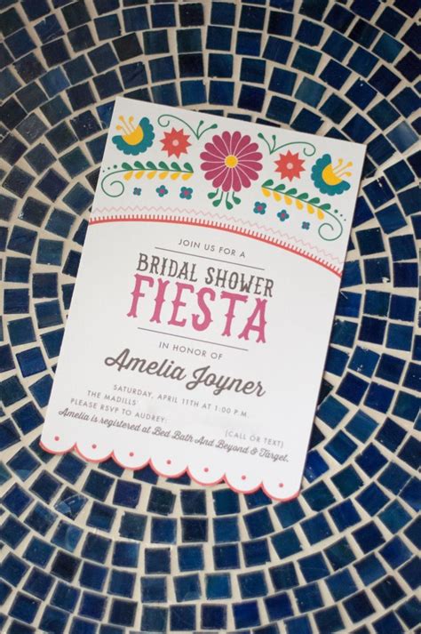 A Colorful Fiesta Themed Bridal Shower Is Displayed On A Blue Mosaic