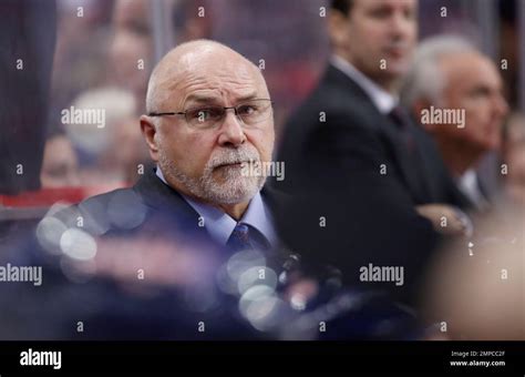 Washington Capitals Head Coach Barry Trotz Stands In The Bench During