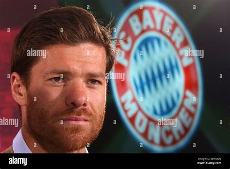 New signing Xabi Alonso of FC Bayern Munich looks on during a press ...