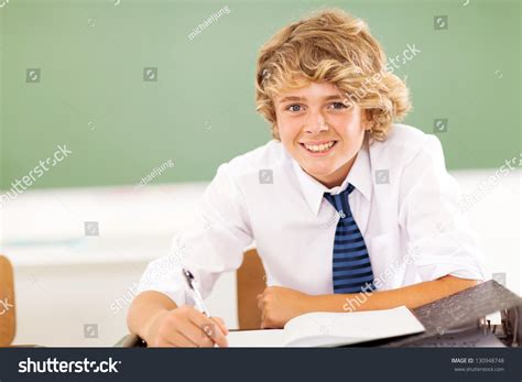 Cute Middle School Boy Studying In Classroom Stock Photo 130948748