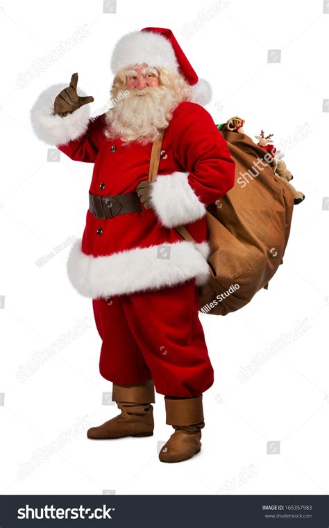 Full Length Portrait Of Real Santa Claus Carrying Big Bag Full Of Gifts