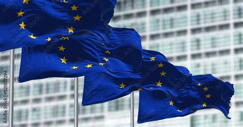 Group Of Flags Of The European Union Waving In The Wind Stock Photo