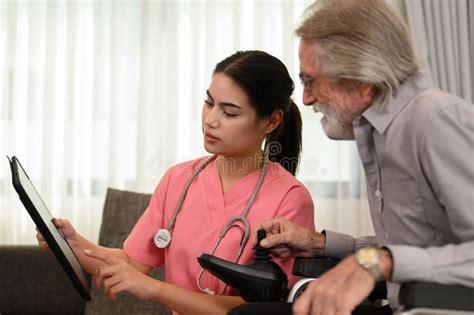 Professional Female Doctor With Stethoscope Visiting Patient Stock Image Image Of Mature
