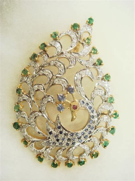 Indian Jewellery and Clothing: Peacock design pendants and earrings..