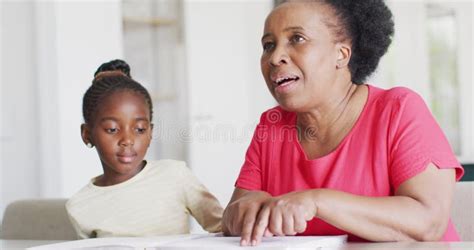 Video Of African American Granddaughter Listening To Her Smiling