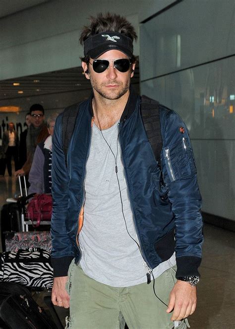 Bradley Coopers Visor Hair Is On A Whole Other Level Bradley Cooper Blue Bomber Jacket How