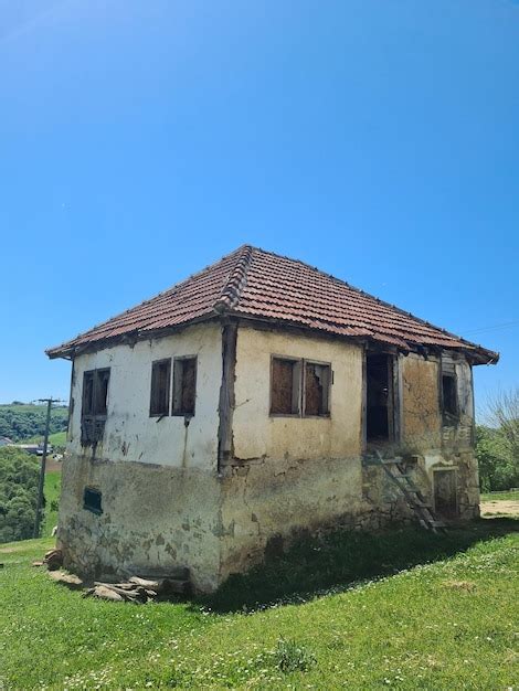 Premium Photo A Small House With A Red Roof And A Small Window On The