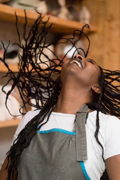 Premium Photo | Portrait of a woman with braided hair smiling