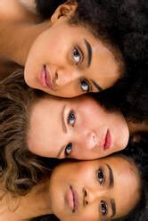 Multi Ethnic Nude Women Posing Together Stock Photo