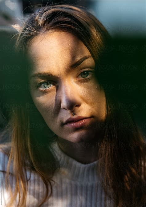 Portrait Of Young Adult Female Outdoors With Shadows And Face Obscure By Stocksy Contributor