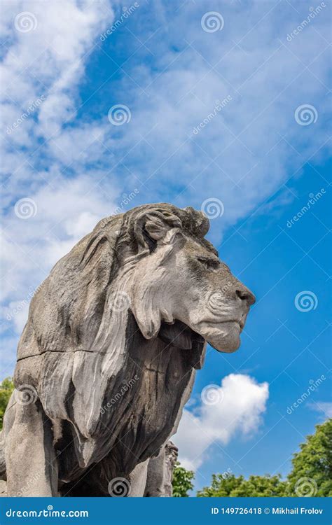 Stone Lion Stone Statue Of A Lion Against The Blue Sky Stock Photo