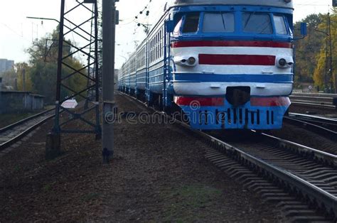 Old Soviet Electric Train With Outdated Design Moving By Rail Stock