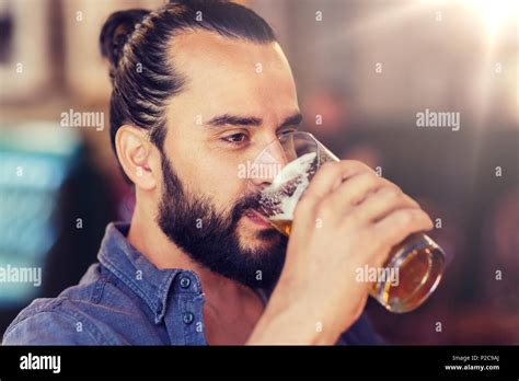 Happy Man Drinking Beer At Bar Or Pub Stock Photo Alamy