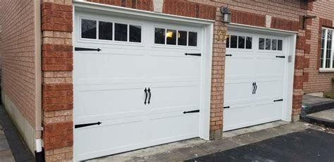 White Barn Styled garage doors installation in Leslie, Toronto