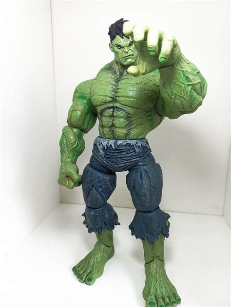 An Action Figure Is Posed In Front Of A White Background With The Hulk