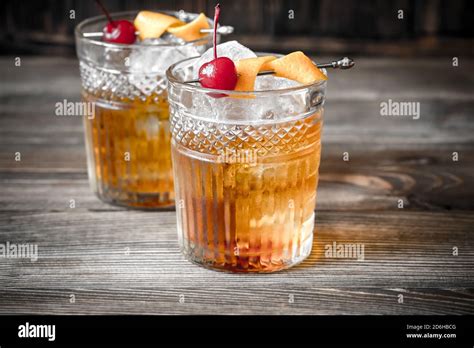 Two glasses of old fashioned cocktail Stock Photo - Alamy