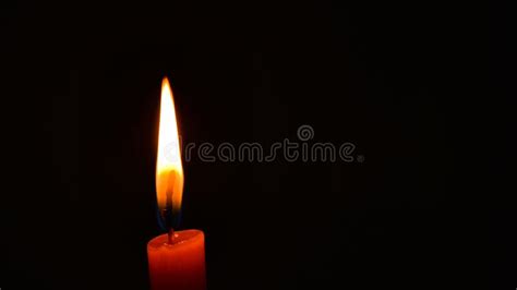 Burning Orange Candle Flame In Darkness Copy Space Concept Peace Hope