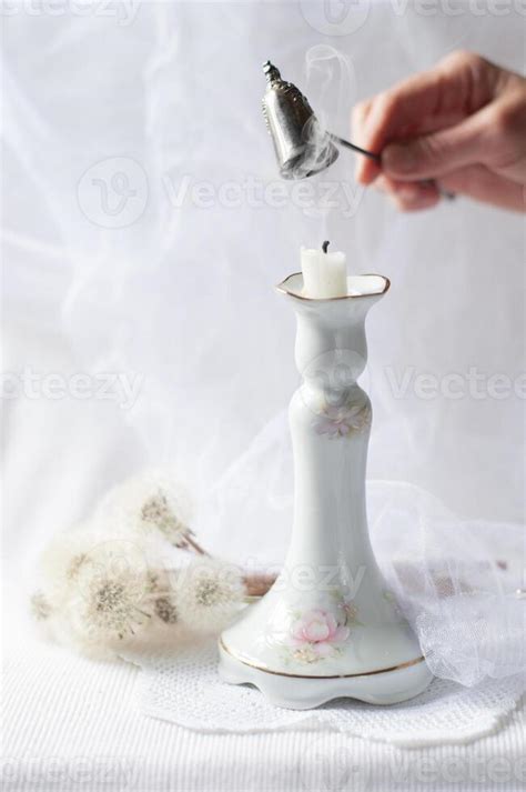 Woman Extinguishes A Candle With A Silver Fire Extinguisher Still Life