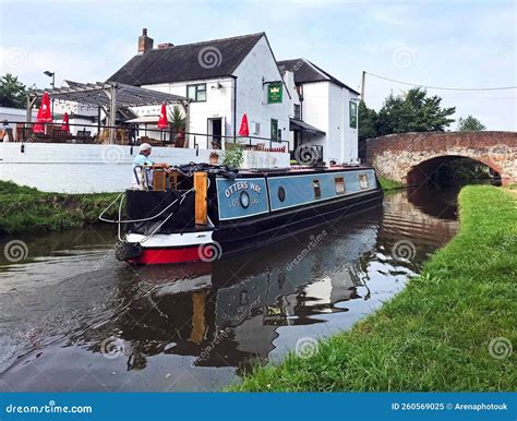 Narrowboat Passing Under Steel Girder Bridge Editorial Photo