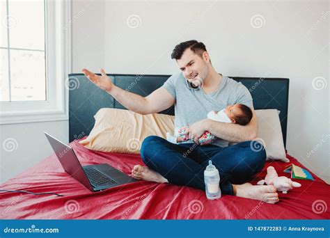 Caucasian Father Dad With Newborn Mixed Race Asian Chinese Baby Working