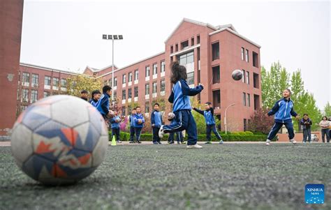 Foreign Football Coaches Give Instructions To Young Football Players In