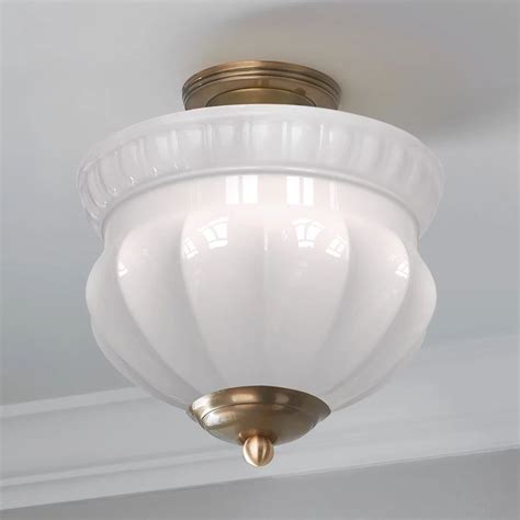 A White Light Hanging From The Ceiling In A Room