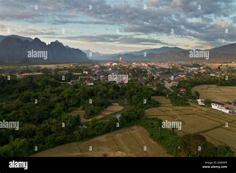 Landscape Of Vang Vieng Laos Hot Air Baloon In The Sky Stock Photo