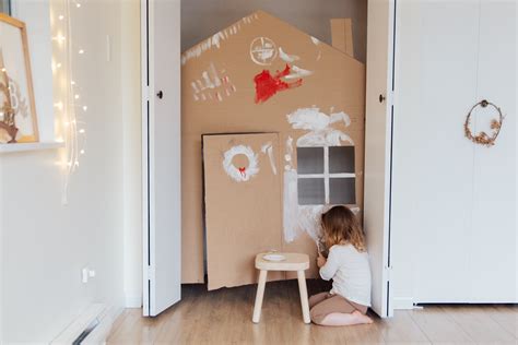 Girl Painting Cardboard House · Free Stock Photo