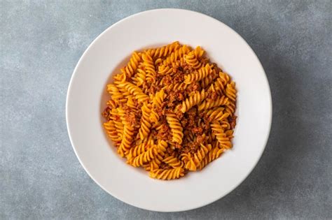 Premium Photo Fusilli Pasta Spiral Or Spirali Pasta With Tomato