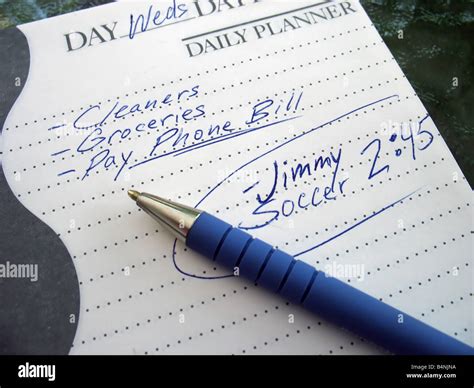 a very busy schedule written out on a daily planner Stock Photo - Alamy