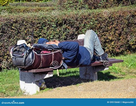 Homeless Man Is Sleeping On A Bench Stock Photo Image Of Jacket Wood