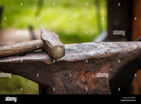 Worn Iron Anvil And Hammer Stock Photo Alamy