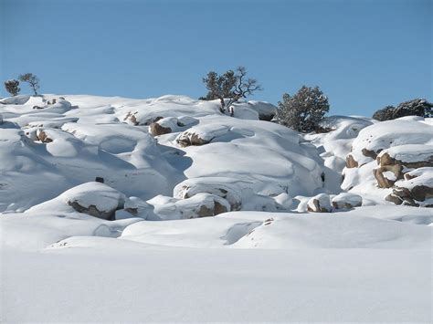 Snow And Rock Photograph by Vickie Treadway