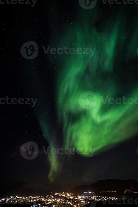 Massive green Northern lights shining over Nuuk city, Greenland ...