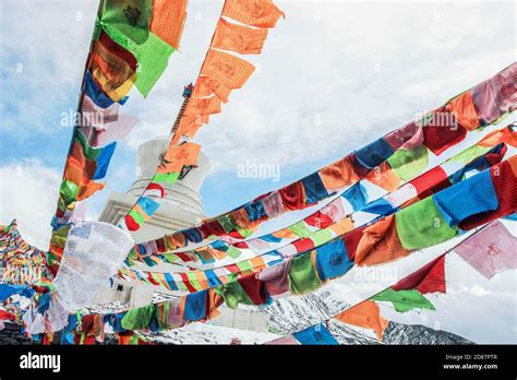 Landscape Of Colorful Buddhist Prayer Flags On Snow Mountain Stock