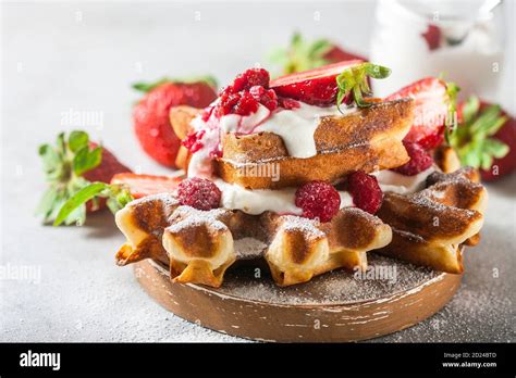 Belgian Waffles With Creem And Raspberries And Strawberries Stock Photo