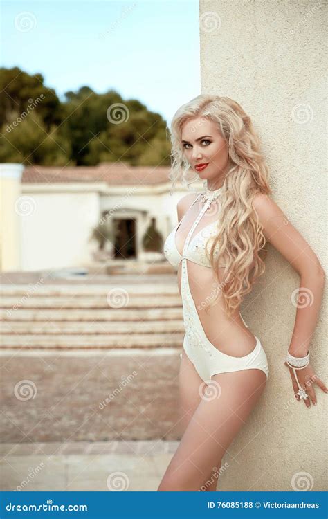 Long Wavy Hair Beautiful Woman Model In Beige Bikini Posing Stock Photo Image Of Column