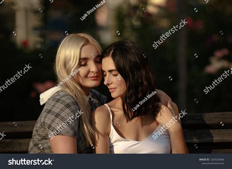 Blonde Brunette Lesbians Holding Each Other Stock Photo 1200528346