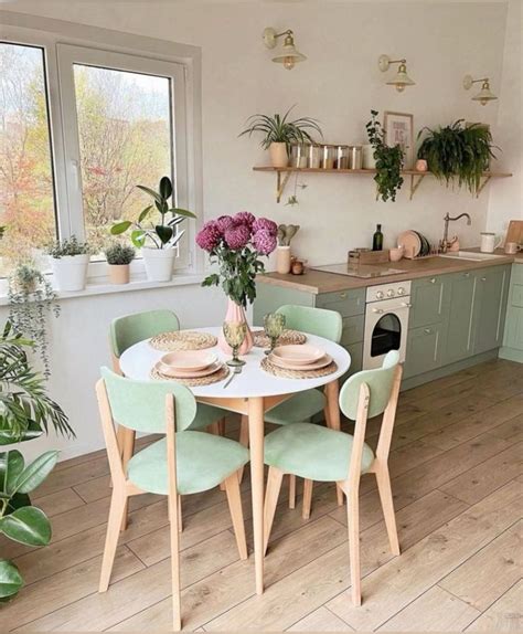 Farmhouse Kitchen Design with Green Cabinets and Plants