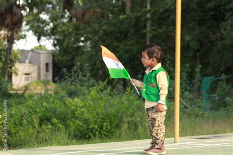 little indian boy proudly holding Tricolour Indian National flag. Stock ...