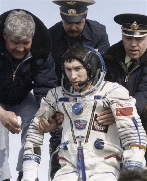 Sergei Krikalev emerges from a Soyuz capsule after spending time on the ...