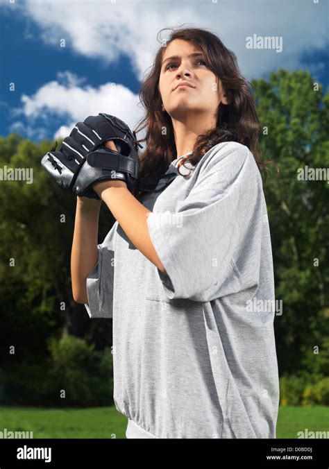 Expressive Portrait Of A Teenage Girl With A Glove Practicing Baseball