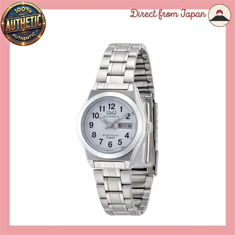 citizen qq   womens solar analog  white dial day date
