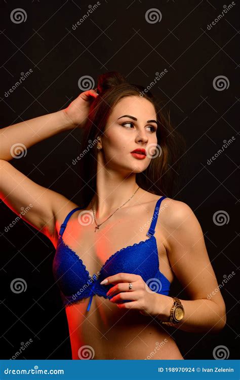 Fashion Brunette Woman With Long Dark Hair In Blue Lingerie Isolated