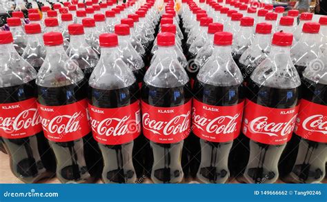 coke bottles stacked  plastic container editorial image