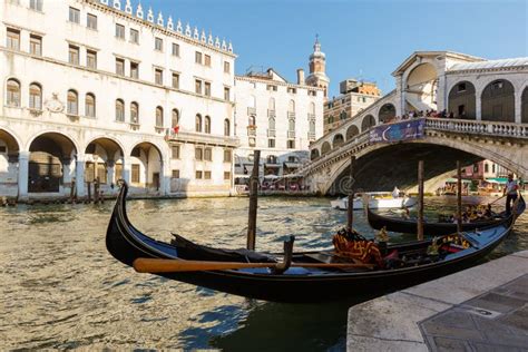 View of Gondola and Ponte Di Rialto, Many Tourists on a Bridge. Sunset ...