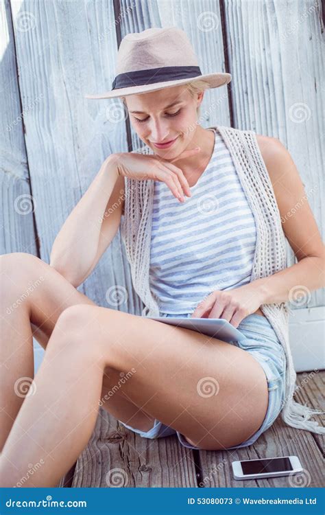 Pretty Blonde Woman Using Her Tablet Stock Image Image Of Leisure Shorts