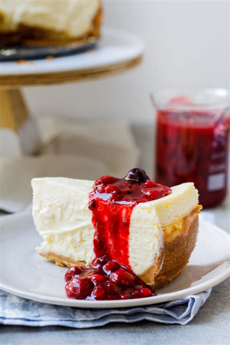 Classic Lemon Cheesecake With Easy Berry Sauce Simply Delicious